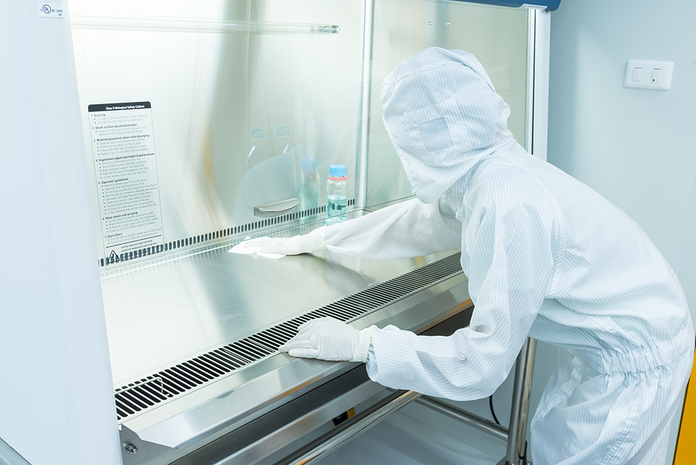 person cleaning hood